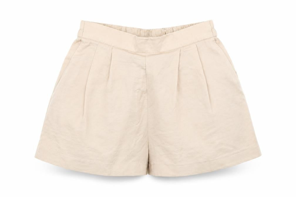 Front view of H&M women’s pink paperbag shorts, size UK 4