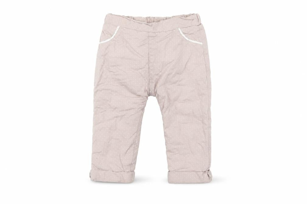 Front view of Nutmeg girls’ beige polka dot windbreaker trousers, size 9-12, months