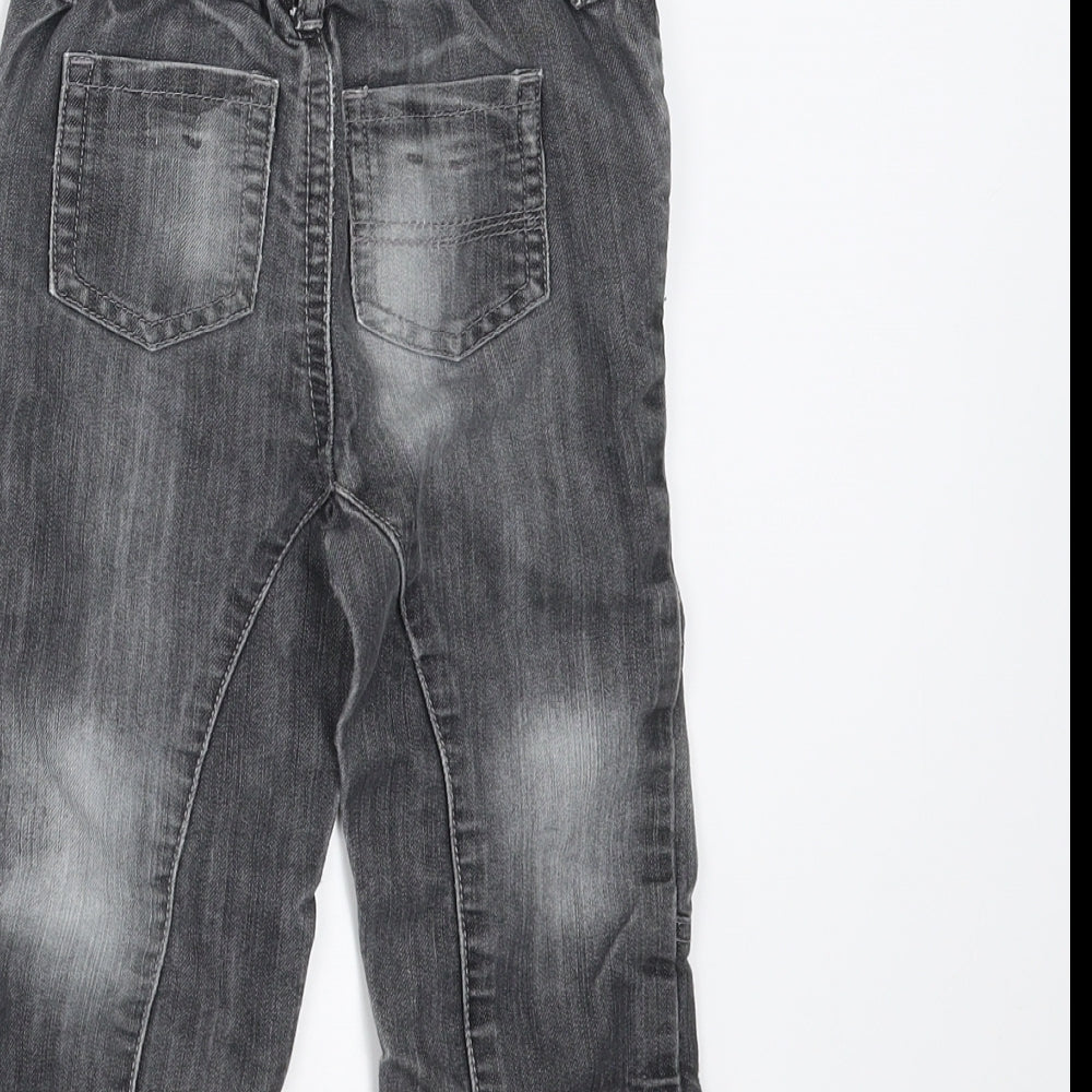 Brand and care label for Baby Boutique boys’ grey denim jeans, size 12-18, months