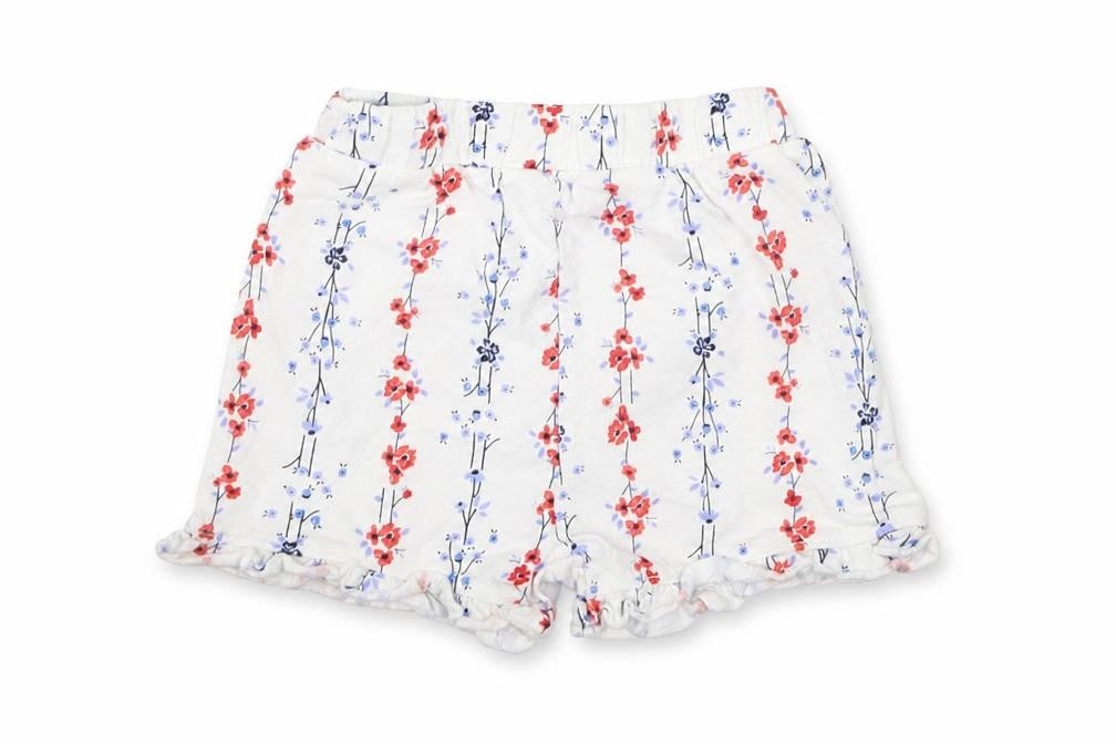 Front view of Matalan girls’ white floral cropped trousers, size 9-12, months
