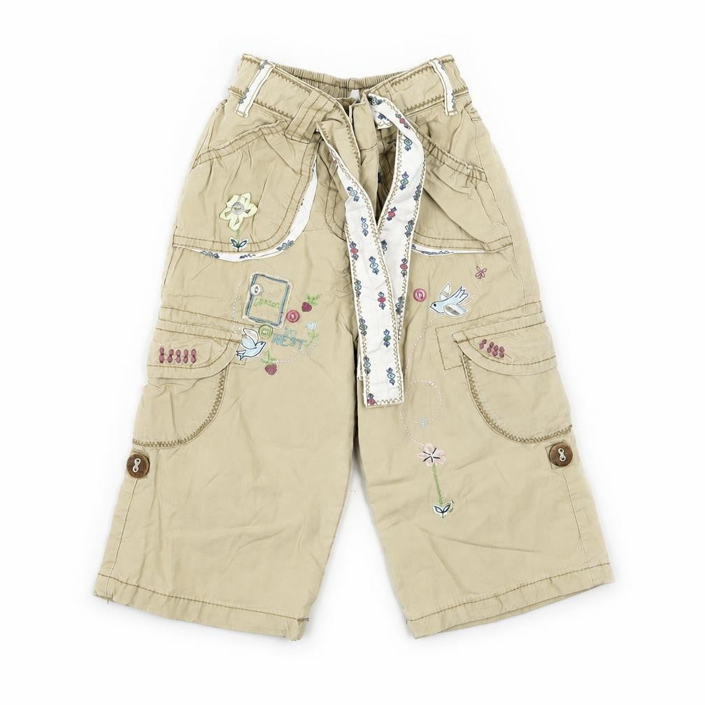 Front view of Next girls’ beige trousers, size 9-12, months - embroidered detail