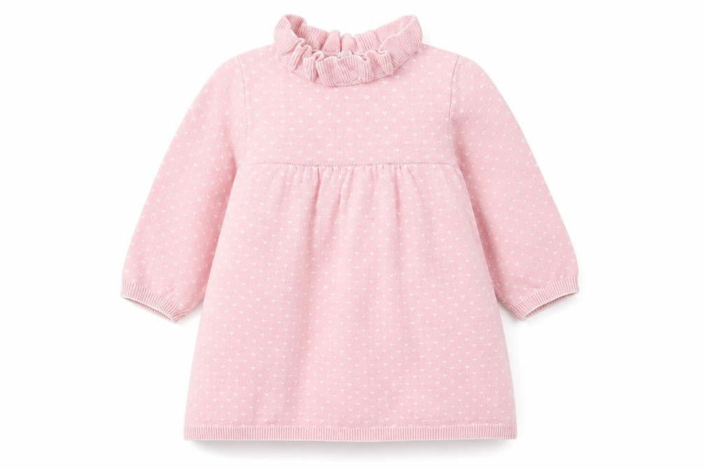 Front view of Nutmeg girls’ pink jumper dress, size 6-9, months - heart pattern