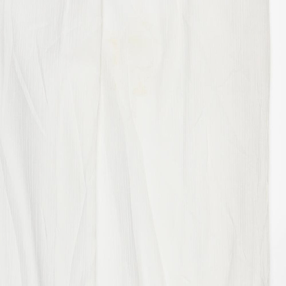 Brand and care label for Canda women’s white bloomer trousers, size UK 12, 29-inch leg