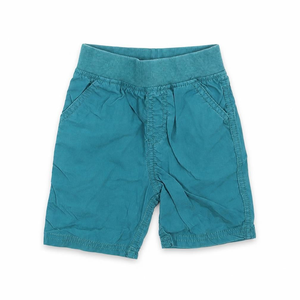 Front view of indigo collection Baby Green Trousers, size 12-18, Months - shorts