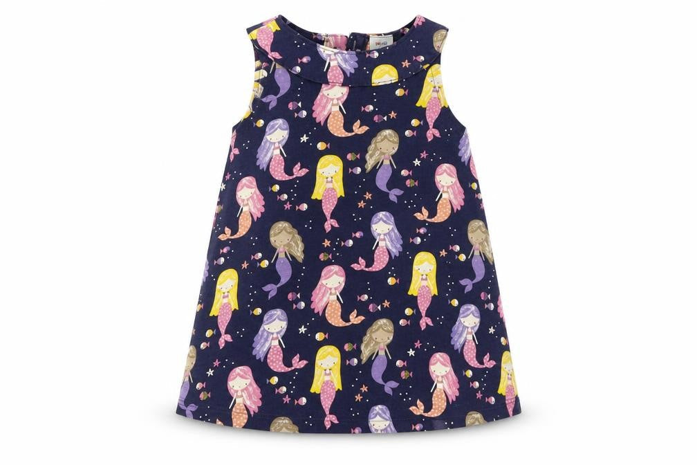 Front view of Mini Club girls’ blue geometric t-shirt dress, size 12-18, months