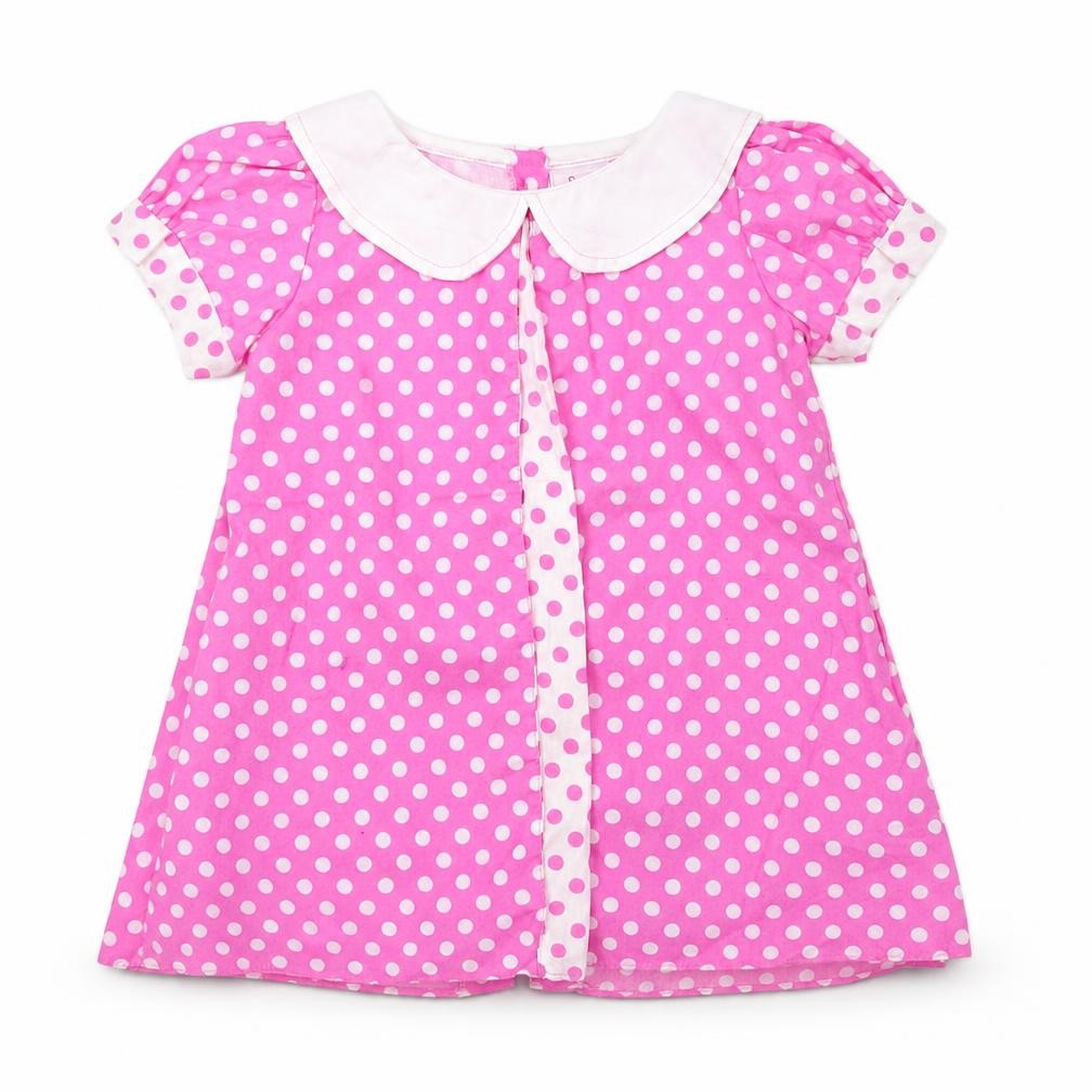 Front view of sweet elegance girls’ pink polka dot a-line, size 12, months