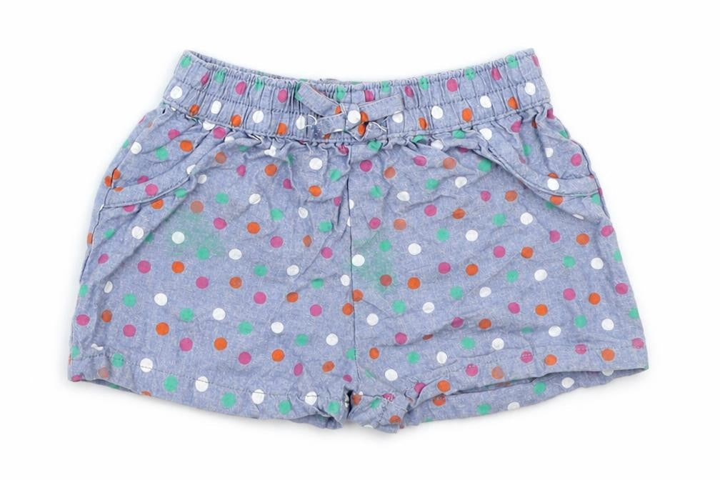 Front view of Jainco girls’ blue polka dot cropped trousers, size 6-9, months