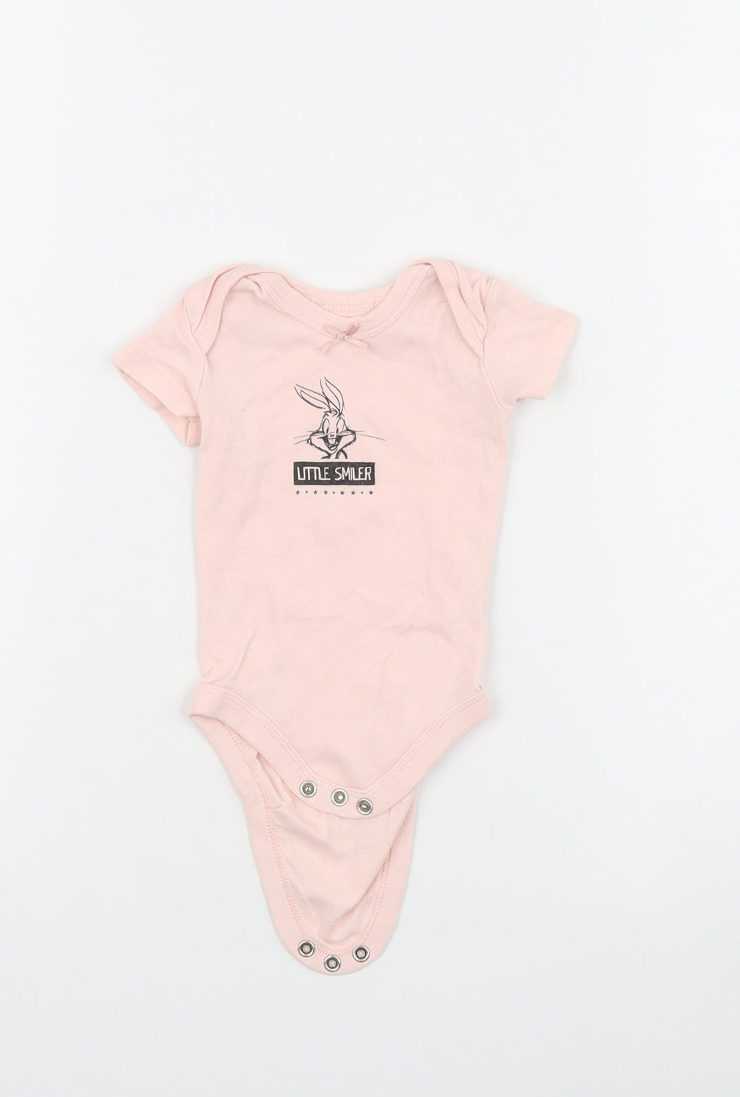 Front view of Looney Toons girls’ pink babygrow one-piece, size 0-3, months