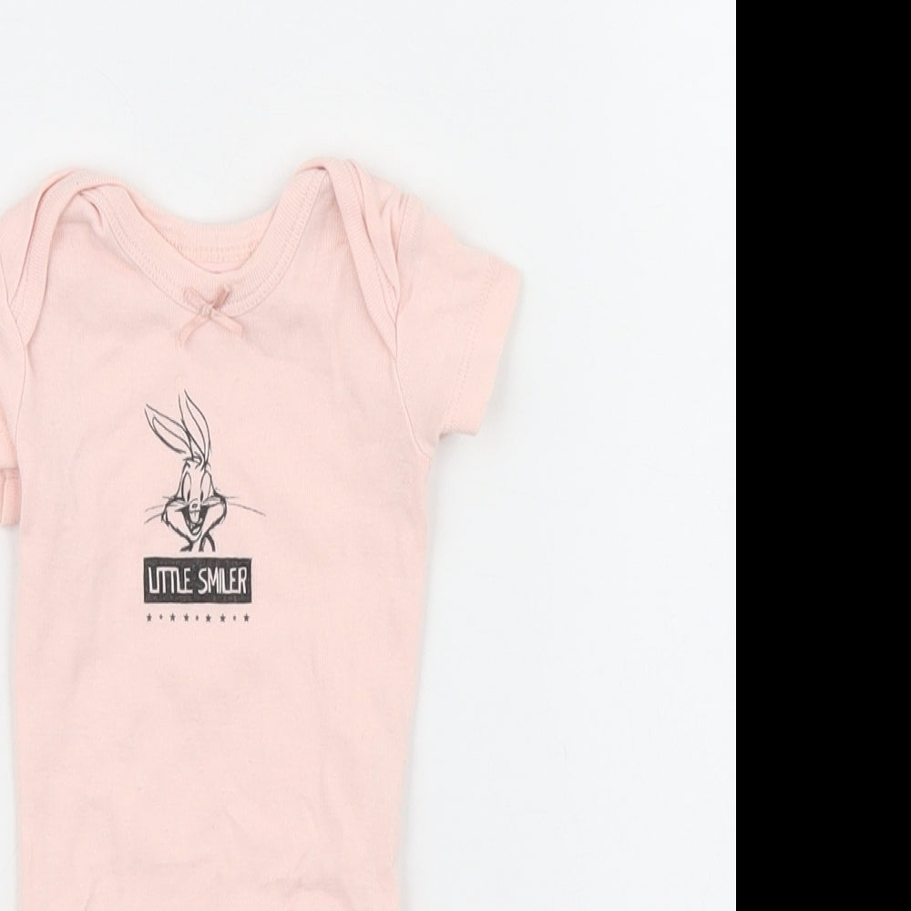 Close-up detail of Looney Toons girls’ pink babygrow one-piece, size 0-3, months