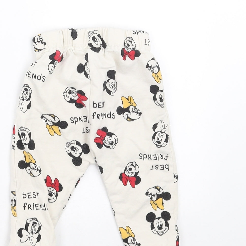 Brand and care label for LC Waikiki Baby Ivory Jogger Trousers, size 6-9, Months - Mickey and Minnie Mouse