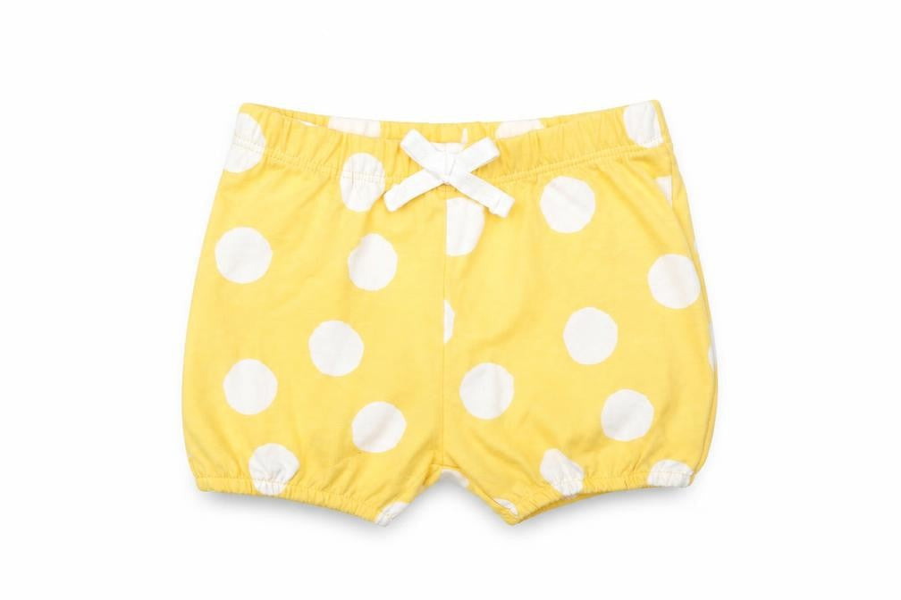 Front view of Marks & Spencer girls’ yellow polka dot 100% cotton capri trousers, months - elasticated waist bow detail