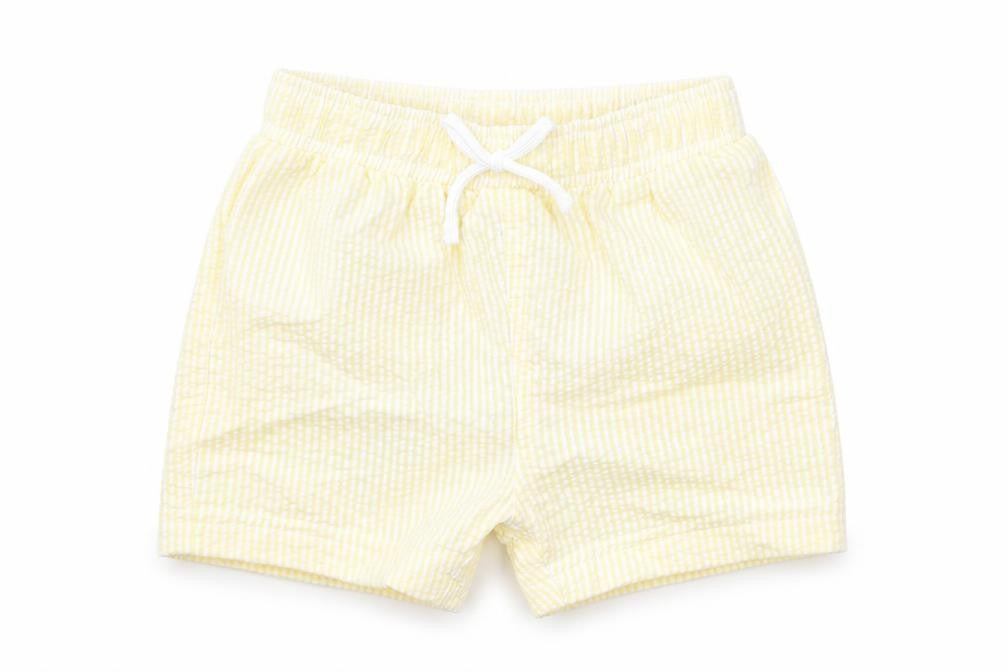 Front view of Marks & Spencer boys’ yellow striped polyester cropped trousers, size 6-9, months drawstring - swim shorts
