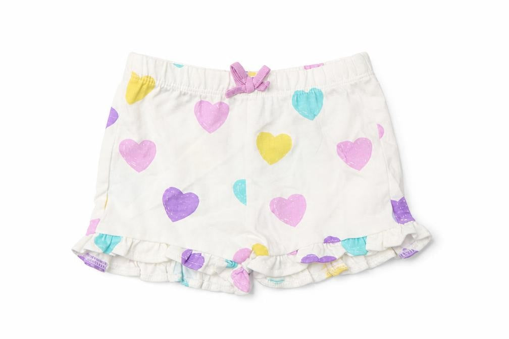 Front view of Marks & Spencer girls’ multicoloured geometric cotton cropped trousers, months pullover - heart pattern