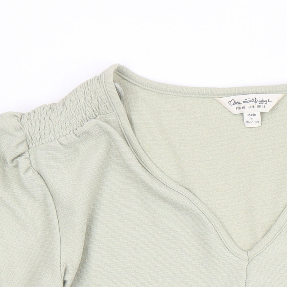 Close-up detail of Miss Selfridge women’s green polyester tunic blouse, size UK 12, v-neck