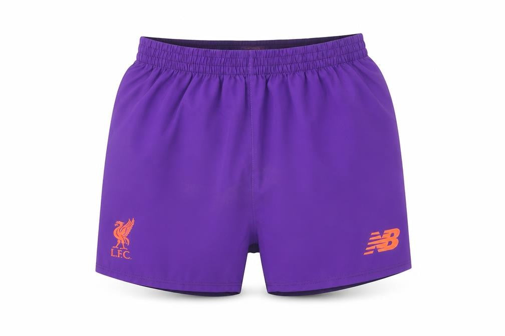 Front view of New Balance boys’ purple athletic football shorts 4-5y