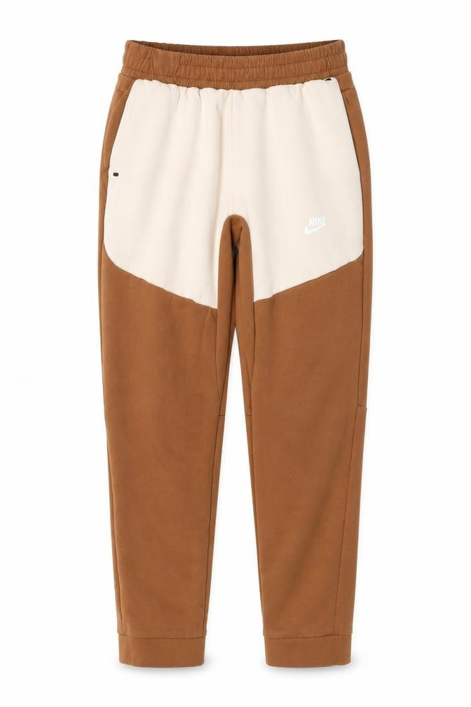 Front view of Nike boys’ brown beige jogger trousers, size 176