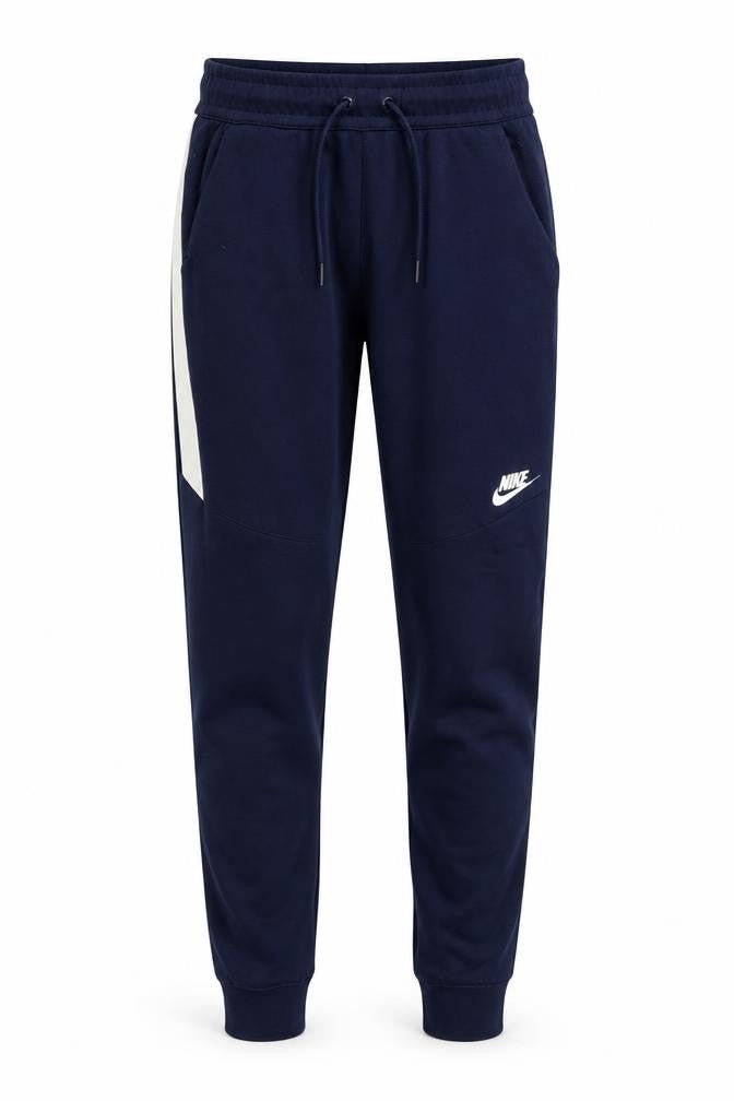 Front view of Nike boys’ blue jogger trousers xs with quick dry feature