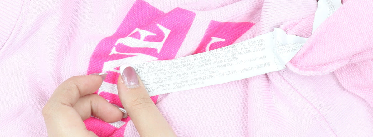 Brand and care label for Zara girls’ pink pullover sweatshirt 13-14 years crew neck