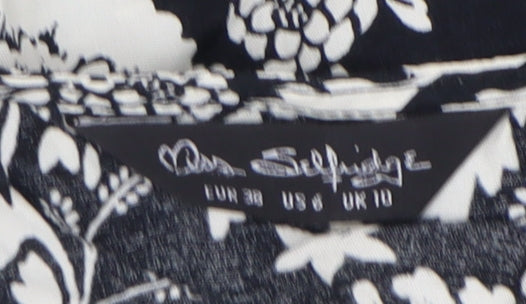 Brand and care label for Miss Selfridge Women's Black Floral Top, size 10