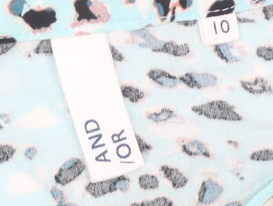 Close-up detail of AND/OR Women's Blue Animal Print Blouse, size 10