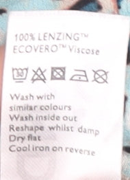 Brand and care label for AND/OR Women's Blue Animal Print Blouse, size 10