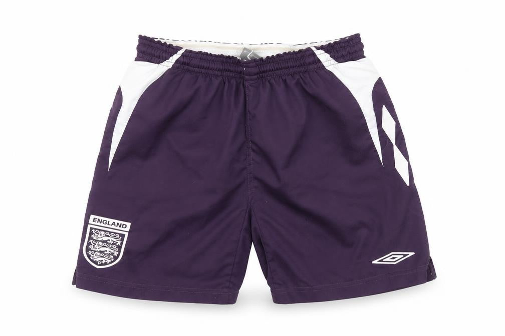 Front view of Umbro boys’' purple athletic football shorts, size 158