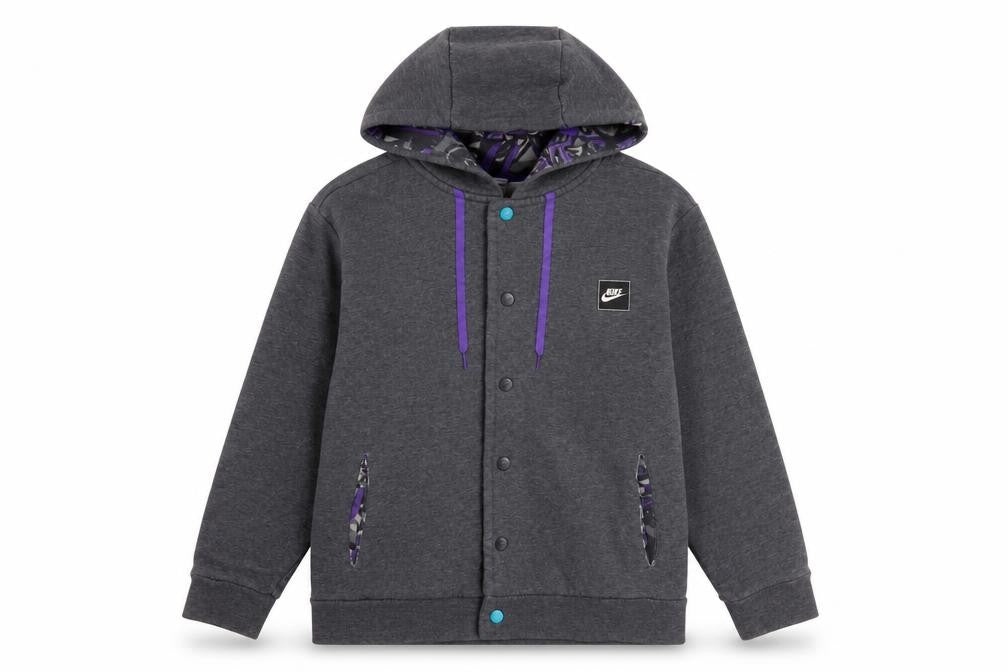 Front view of Nike girls’ grey m hoodie with logo accents