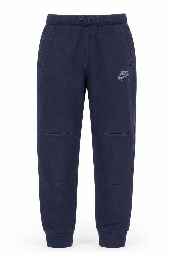 Front view of Nike boys’ blue jogger trousers xl