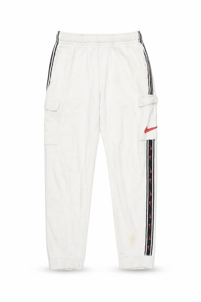 Front view of Nike boys’ white xl track pants for activewear