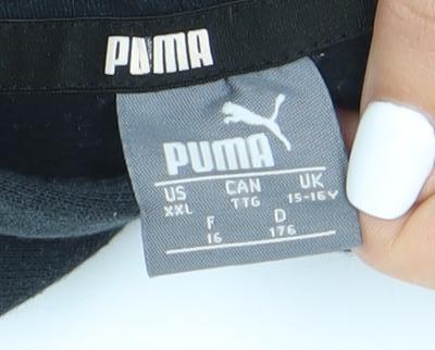 Close-up detail of Puma boys’' black pullover hoodie xl with logo accent