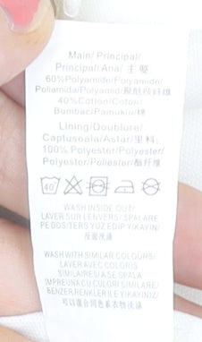 Brand and care label for Missguided women’s ivory short sheath dress, size UK 8