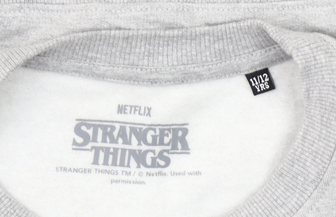 Brand and care label for Stranger Things Hawkins Tigers Grey Sweatshirt girls’ 11-12 years pullover