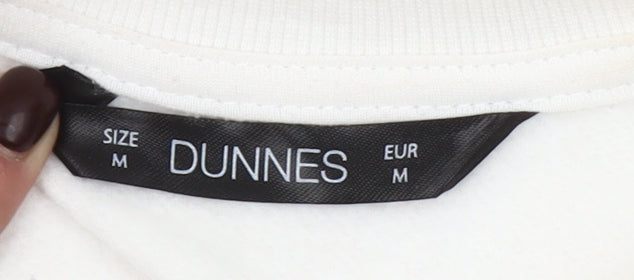 Brand and care label for Dunnes Women Cream New York City Graphic Pullover Sweatshirt M