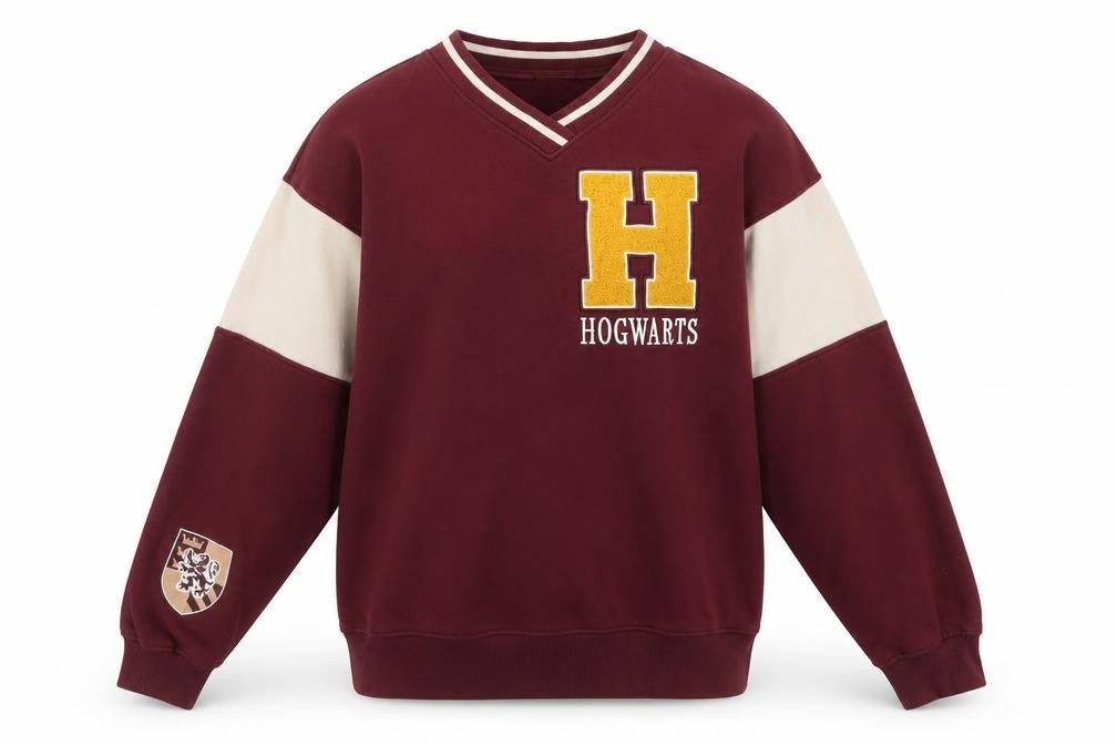 Front view of H&M girls’ red hogwarts sweatshirt 11-12 years v-neck pullover