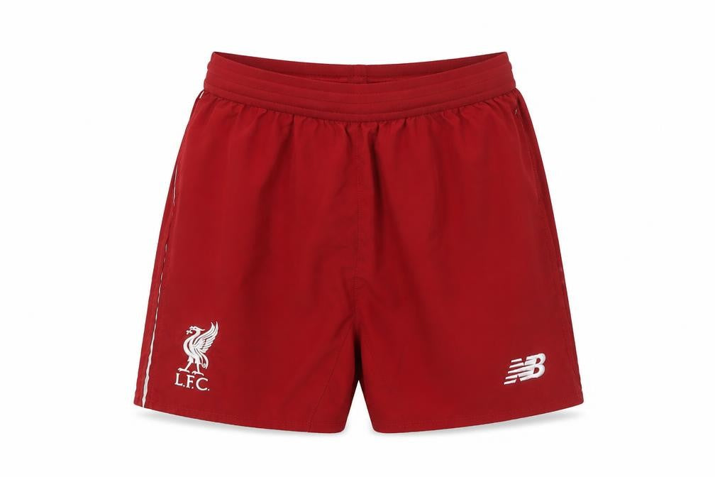 Front view of New Balance boys’ red football athletic shorts 13-14 years lfc sportswear
