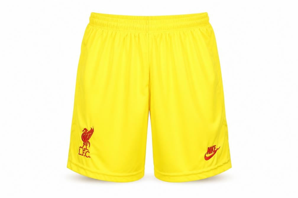 Front view of Nike boys’ yellow liverpool fc football athletic shorts, size 176