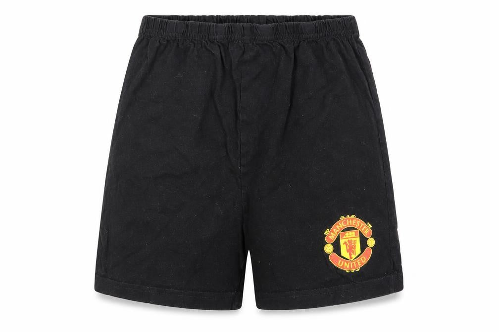 Front view of Manchester United boys’ black 10-11 years cotton athletic football shorts