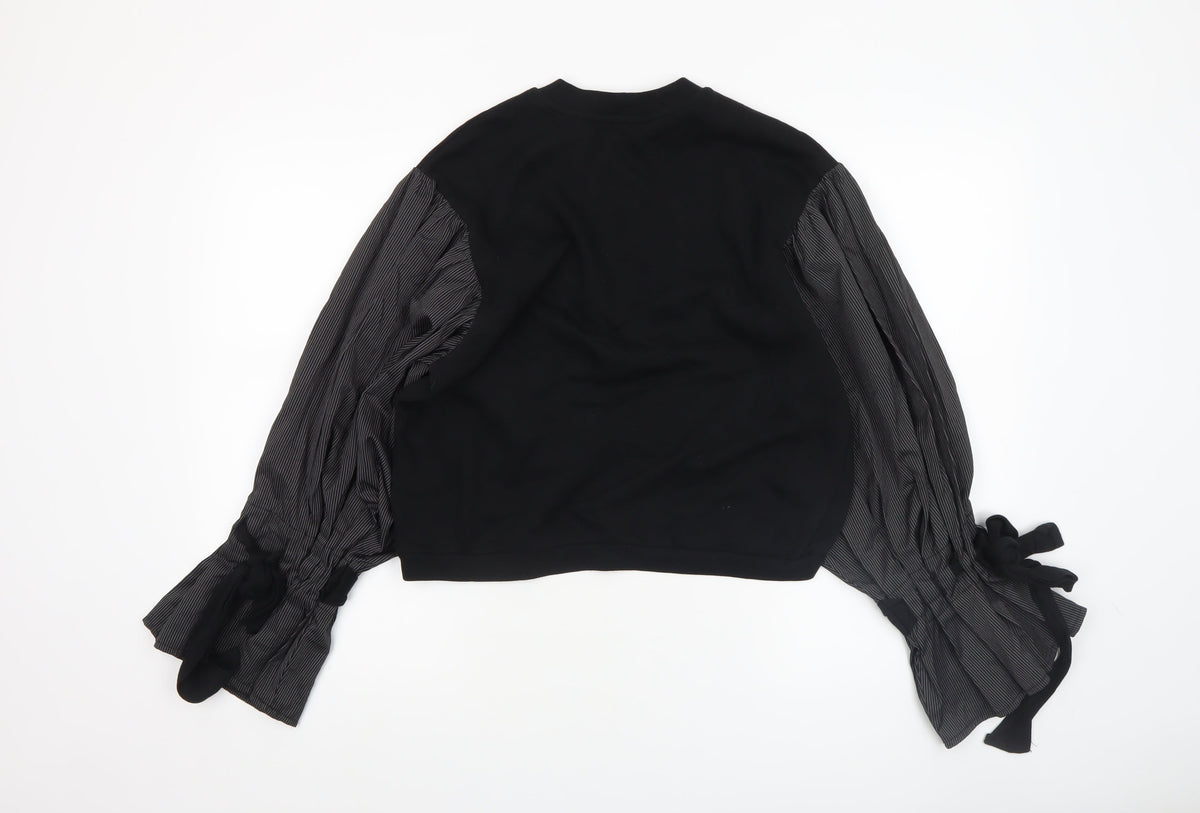 Close-up detail of ASOS women’s black contrast sleeve tunic blouse, size UK 6