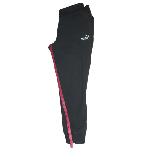 Close-up detail of Puma women’s black jogger fleece sweatpants, size UK 14, regular
