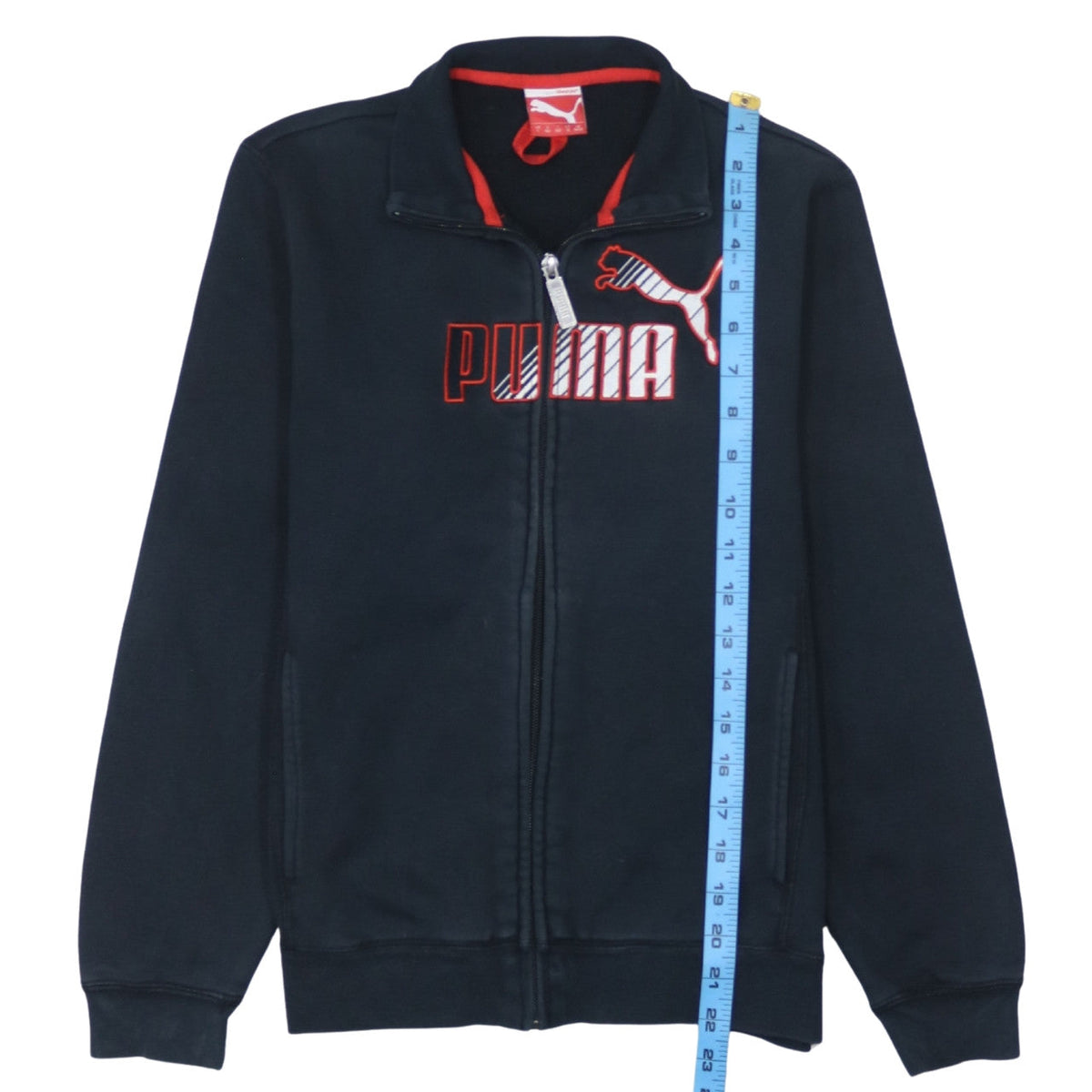 Close-up detail of Puma boys’ black track jacket, size 12, years full zip cotton blend