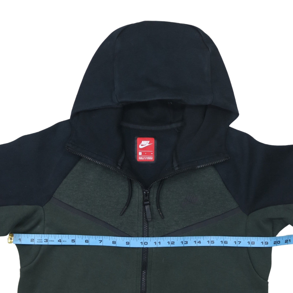 Brand and care label for Nike Men's Green Full Zip Hoodie, size S, Regular Fit