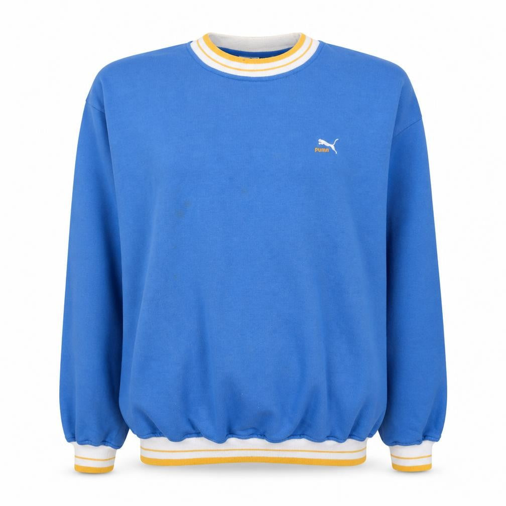 Front view of Puma women’s blue crew neck pullover sweatshirt, size M