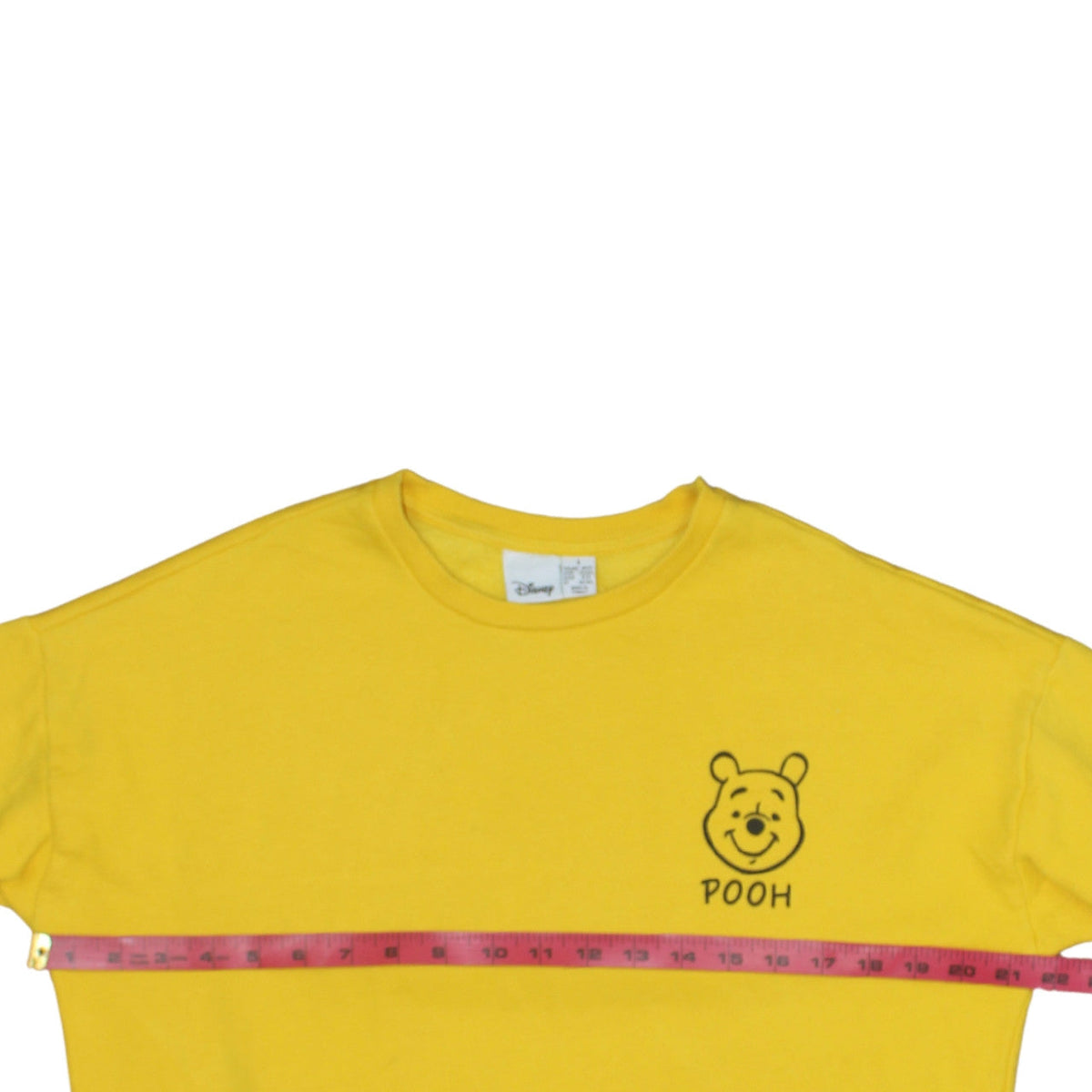 Brand and care label for Disney Winnie the Pooh Yellow Sweatshirt Women S 10/12 Crew Neck