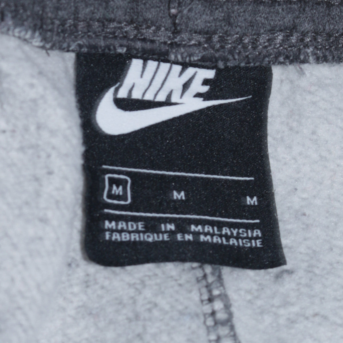 Brand and care label for Nike Men's Grey Fleece Sweatpants M Regular Fit Sports Trousers