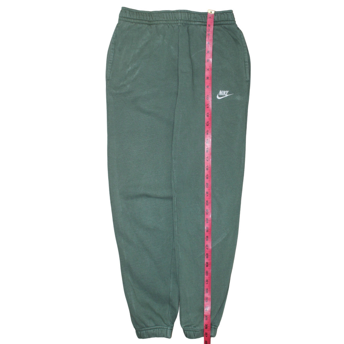 Close-up detail of Nike Men's Green Regular Fit Fleece Sweatpants, size S