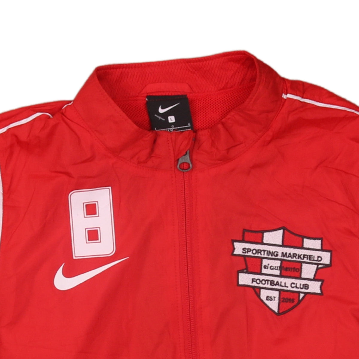 Brand and care label for Nike boys’ red football track jacket, size L, 147-158cm full zip lightweight
