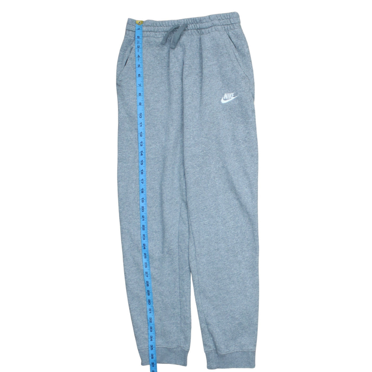 Close-up detail of Nike boys’ grey xl jogger sweatpants with drawstring waist and pockets