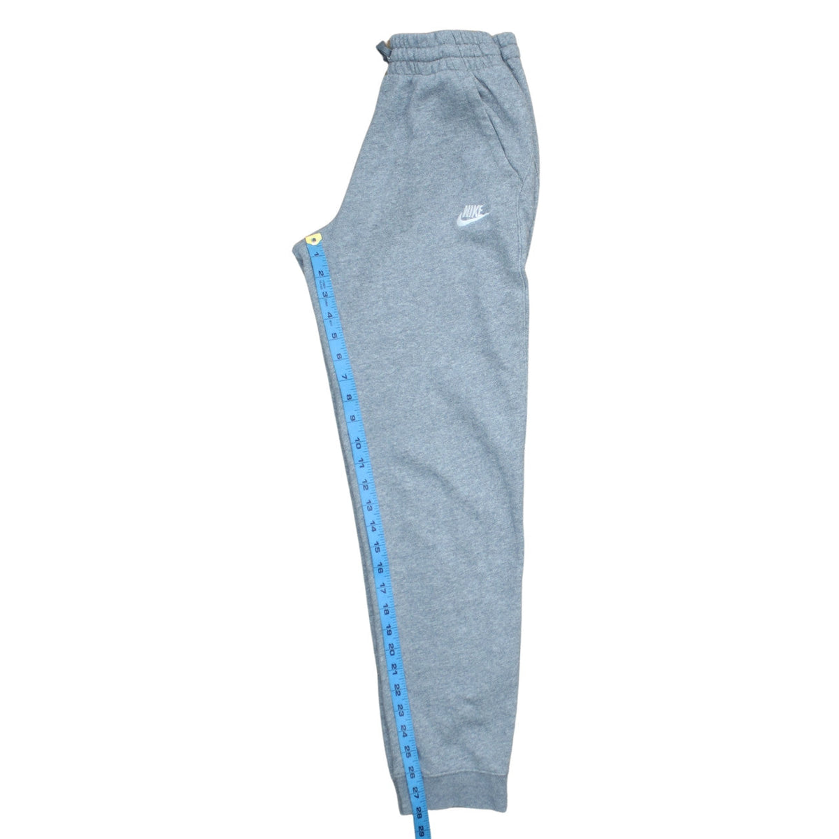Brand and care label for Nike boys’ grey xl jogger sweatpants with drawstring waist and pockets