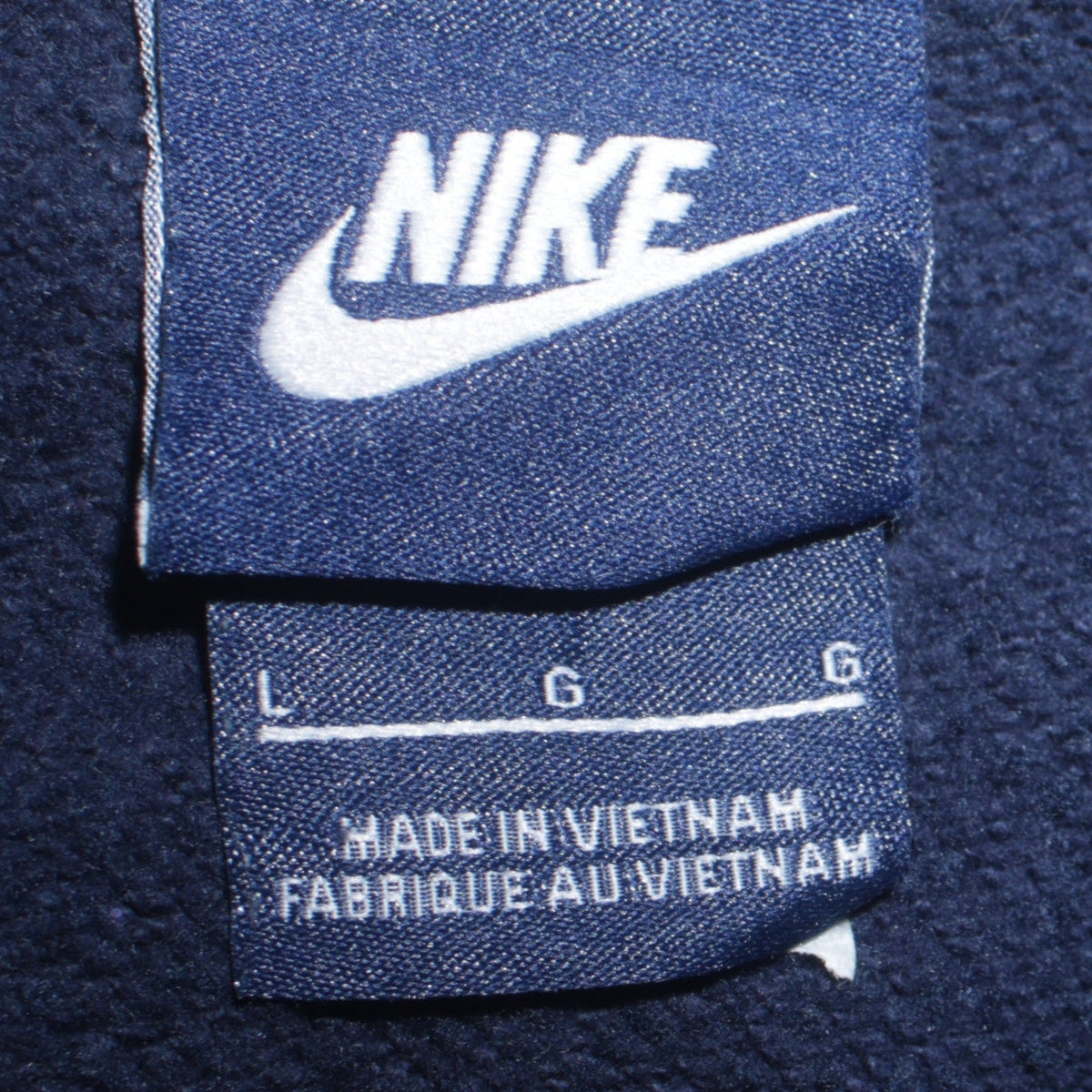 Close-up detail of Nike Men's Blue Full Zip Hoodie, size L, Sports Fleece Sweatshirt