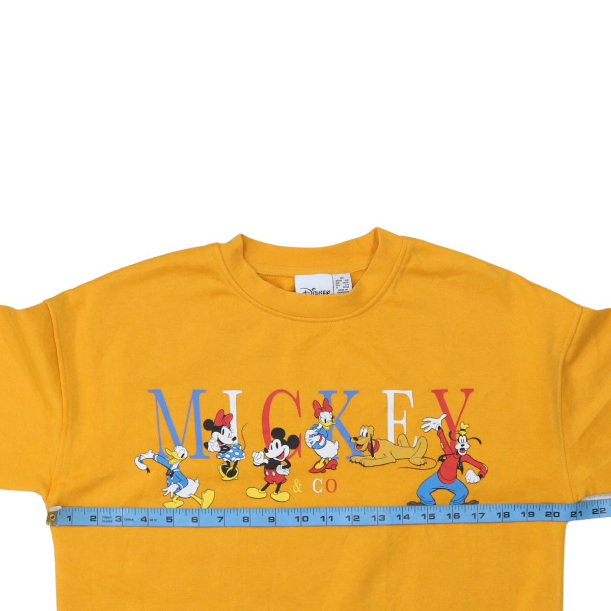 Close-up detail of Disney Women’s Yellow Mickey & Co Sweatshirt XS Primark Cares